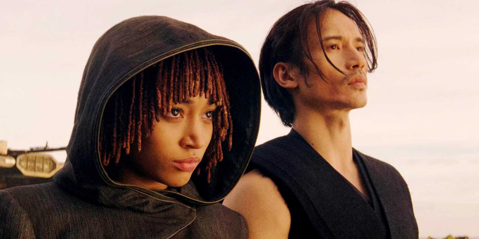 Qimir and Osha standing side-by-side in The Acolyte finale