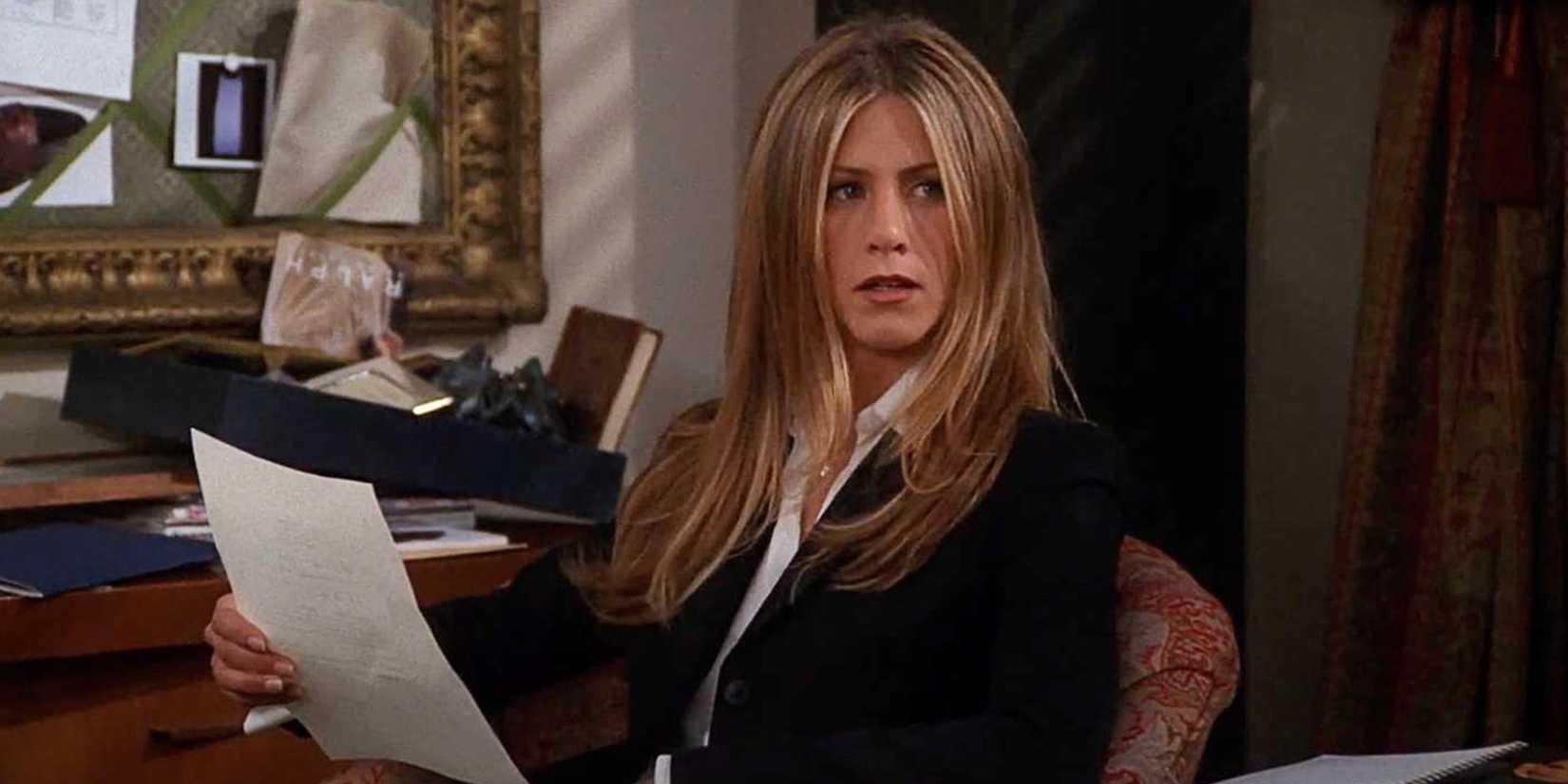 Rachel sitting behind her desk in Friends