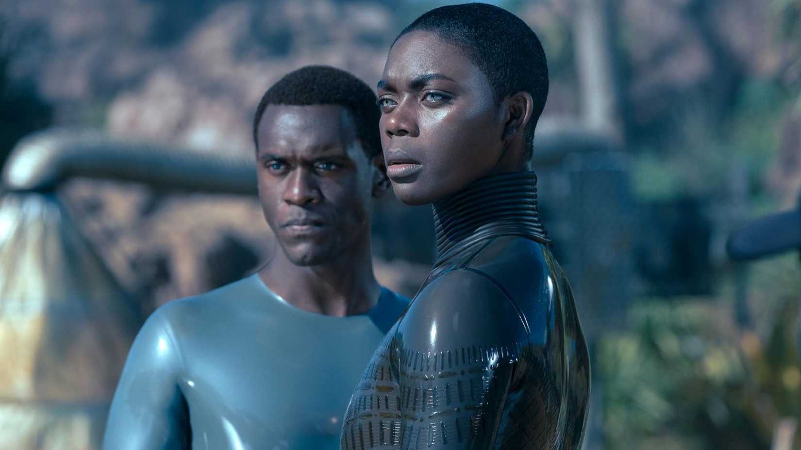 Father and Grandmother stand together in Raised by Wolves