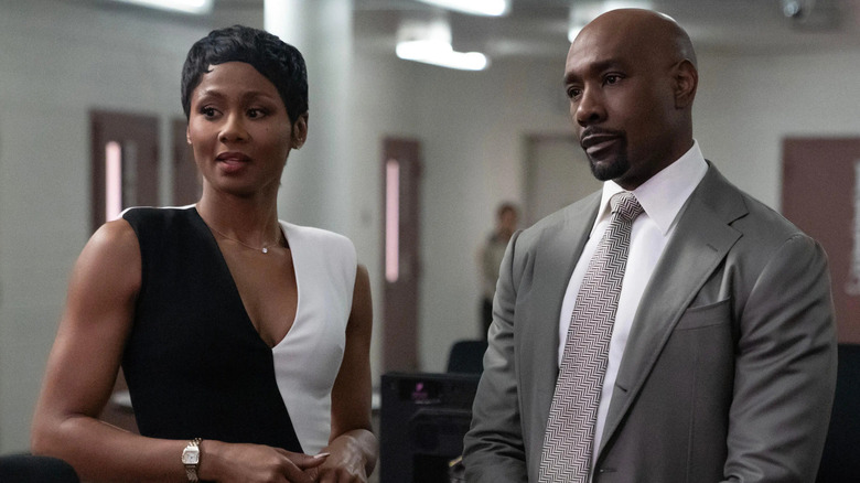 Jax Stewart (Emayatzy Corinealdi) stands next to Corey Cash (Morris Chestnut) in Reasonable Doubt