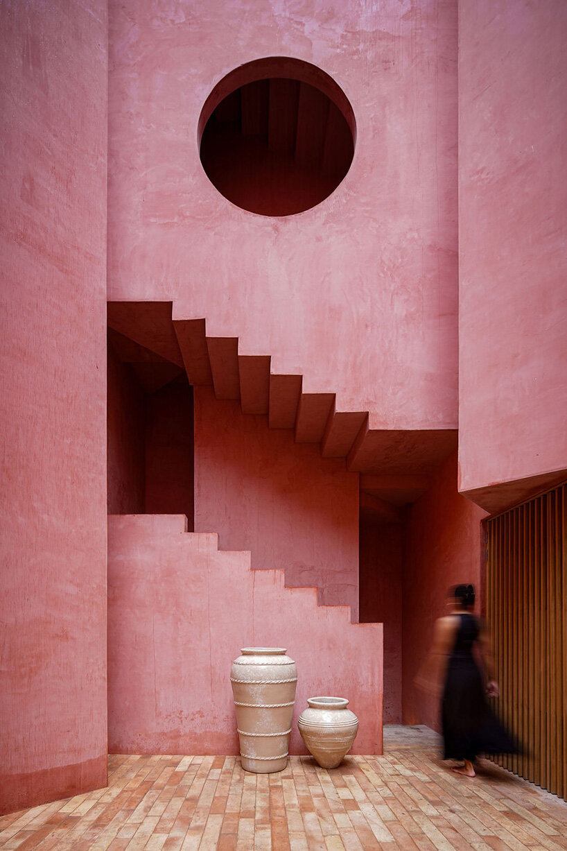 red-toned stucco surfaces form layered facade for boutique hotel by RA! in mexico - 6