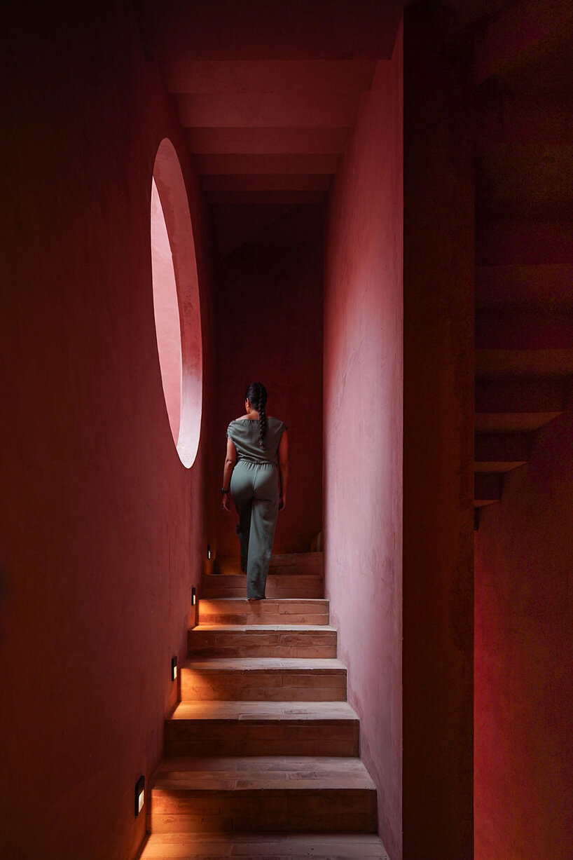 red-toned stucco surfaces form layered facade for boutique hotel by RA! in mexico - 8