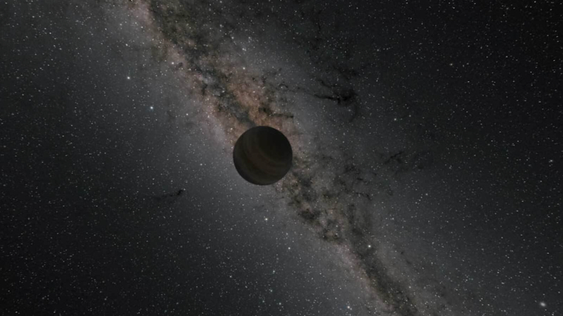 Dimly-lit planet floating in space against background of Milky Way.