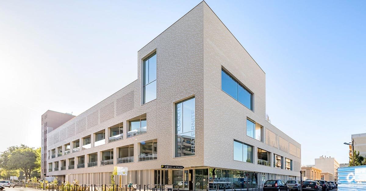 white brick facade wraps school group in france by brenac & gonzalez & associés