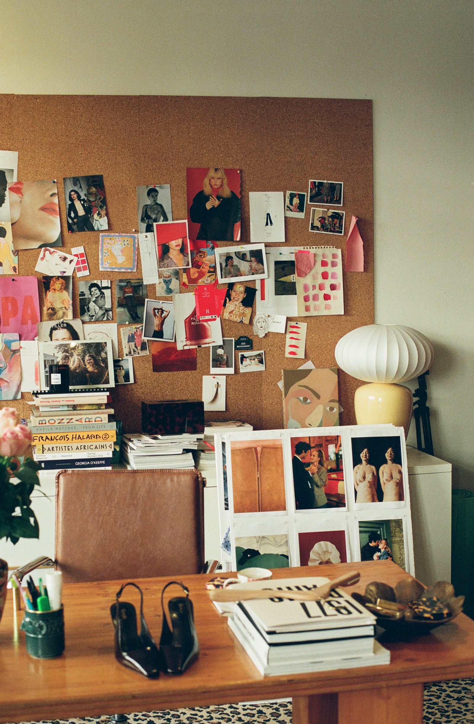 Image may contain Jenny Boyd Furniture Table Desk Adult Person Indoors Interior Design Bed Bedroom and Dorm Room