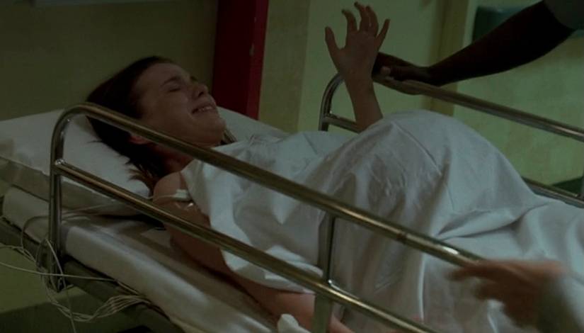 A pregnant woman in a hospital bed in the Fringe episode "Same Old Story"