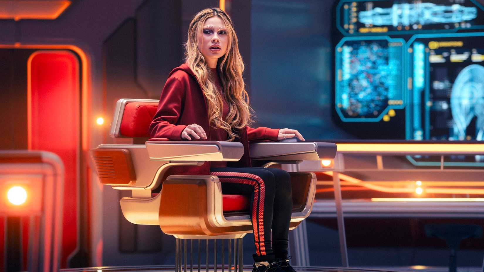 Genesis Lythe (Bella Shepard) sits in the captain's chair on the USS Athena in Starfleet Academy