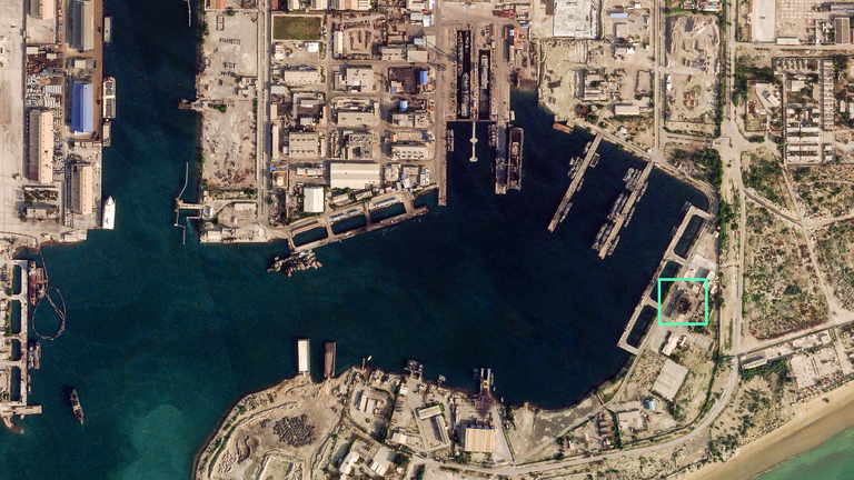 Satellite image from 4 March 2026, shows a hole in the roof of a building at Bandar Abbas port. Pic: Planet Labs PBC 