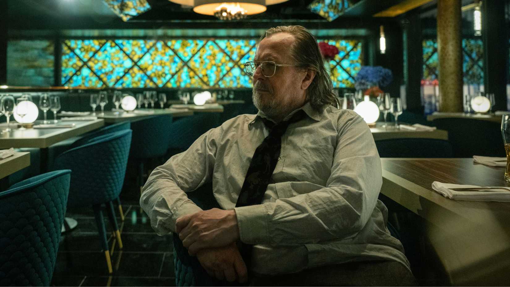 Sir Gary Oldman sitting in a bar in Slow Horses