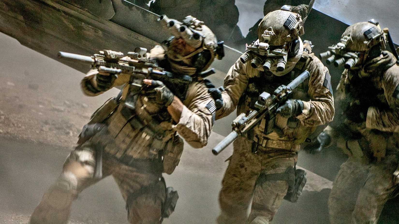 Soldiers in Zero Dark Thirty hold weapons while rushing in the desert