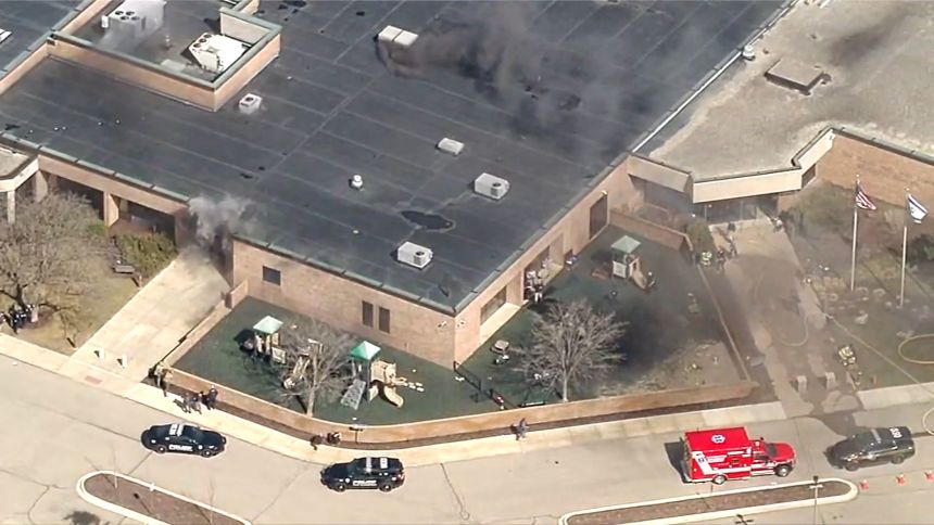 Smoke rises from Temple Israel after the attack on March 12.