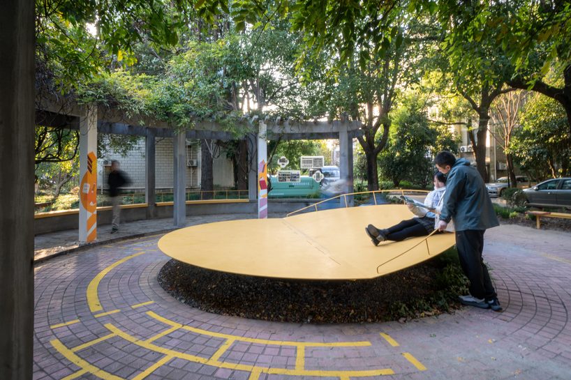 studio RE+N turns abandoned planter into floating yellow stage in shanghai neighborhood - 4