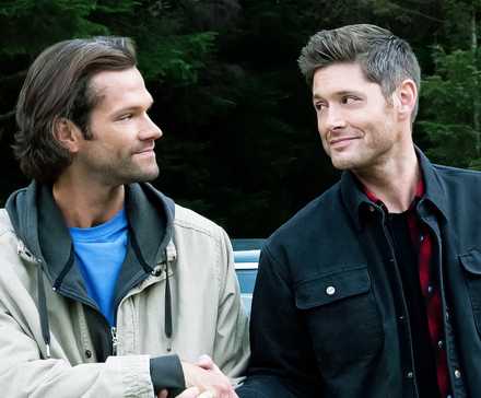 Sam Winchester (Jared Padalecki) and Dean Winchester (Jensen Ackles) shaking hands in the Supernatural series finale