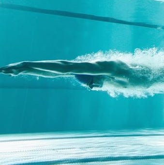 Swimmer underwater after the jump Swimmer underwater after the jump