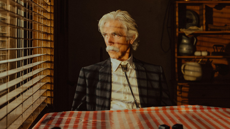 T.L. Norris stares out a window in 