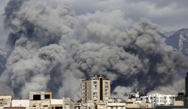 Smoke rises from the area after it was targeted in attacks as a series of explosions are heard in Tehran, Iran on March 01, 2026. The Islamic Republic of Iran Broadcasting (IRIB) building after Iranian authorities said it was targeted in the attacks.