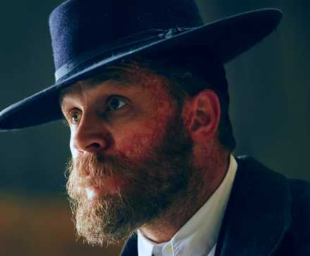 Tom Hardy as Alfie Solomons wearing a hat in Peaky Blinders