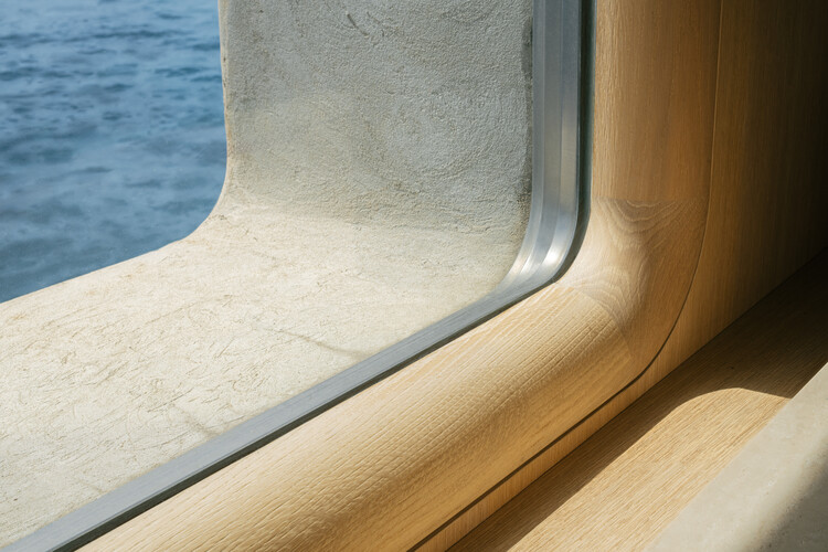 Transforming a Concrete Shell into a Wooden Interior Shaped by the Sea - Image 6 of 15