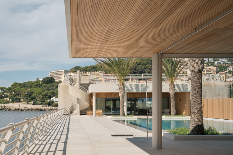 Transforming a Concrete Shell into a Wooden Interior Shaped by the Sea - Image 7 of 15