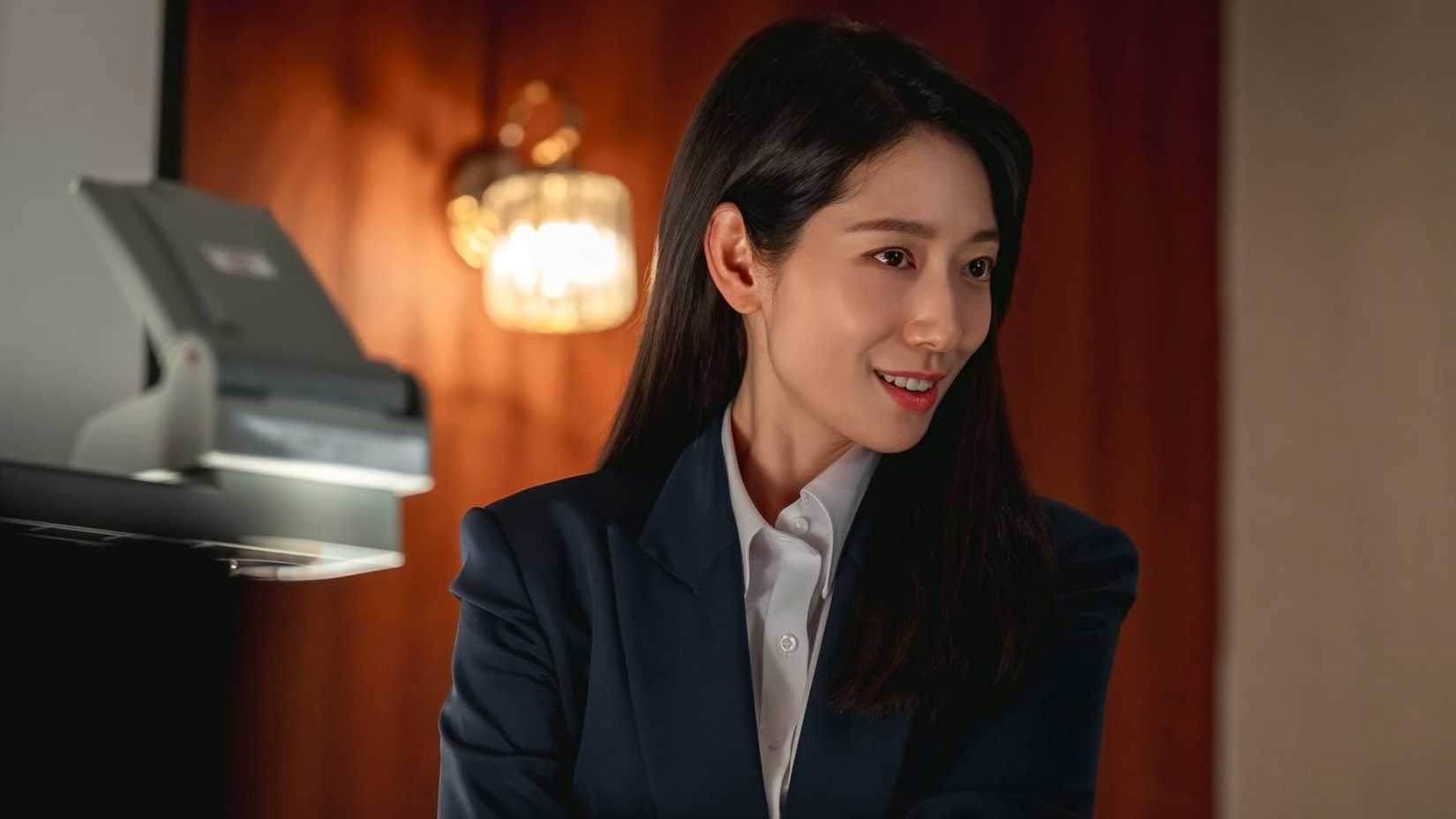 Undercover Miss Hong Netflix character looking to the right with a smile