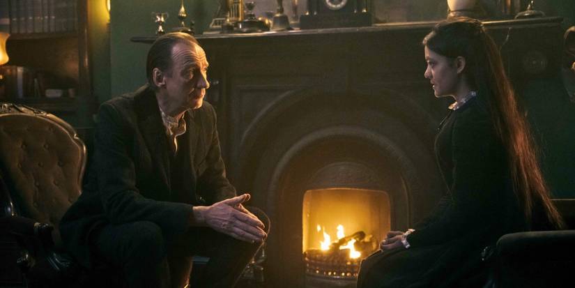 David Thewlis and Blu Hunt sit across from one another, fireside in Sherlock & Daughter.
