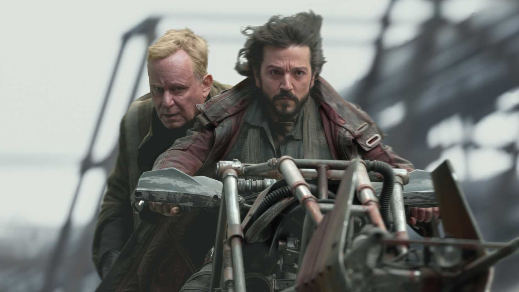 Cassian Andor and Luthen Rael riding on a speeder bike in Andor