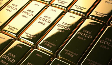 Stacks of gold bars marked FINE GOLD 1000g.
