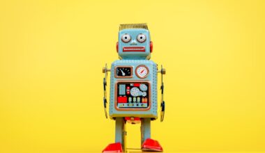 A robot looks at the camera. Yellow background.