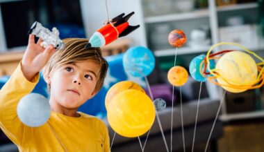 A kid playing with a toy solar system and rockets.