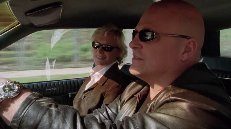 Monica (Glenn Close) sitting in a car with Vic (Michael Chiklis) on 