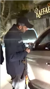 An armed policeman deployed at night in Gaza City during Ramadan (Hamas police Telegram channel, March 12, 2026)