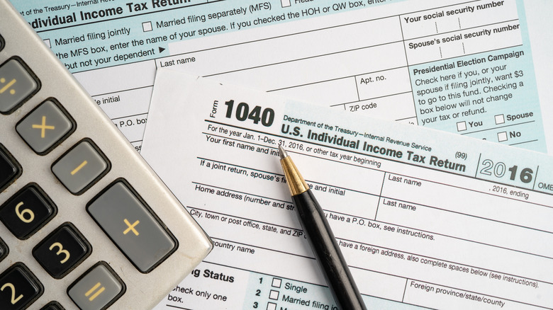 A Form 1040, U.S. Individual Income Tax Return on a table.