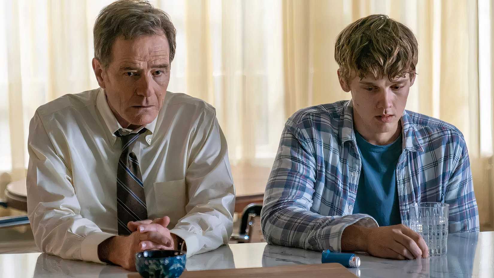 Michael and Adam sit at the table in Your Honor