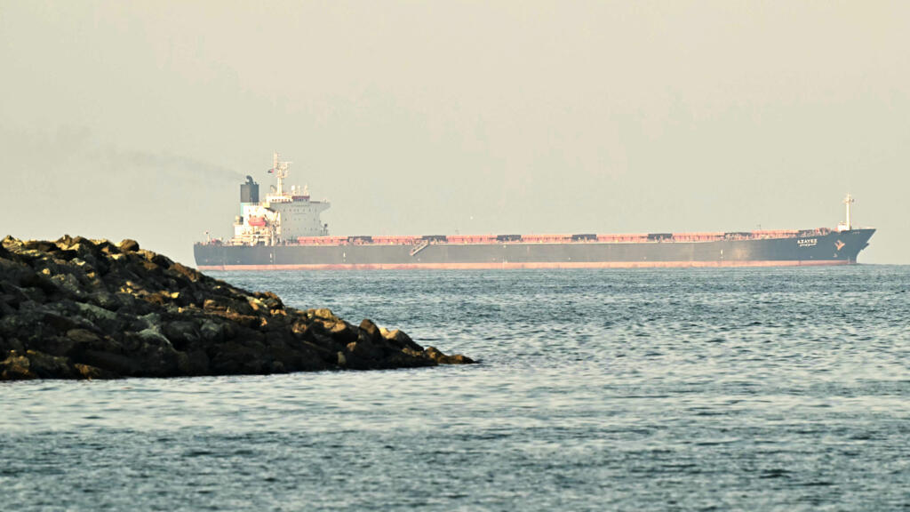 A cargo ship is pictured off coast city of Fujairah, in the Strait of Hormuz in the northern Emirate on February 25, 2026. 