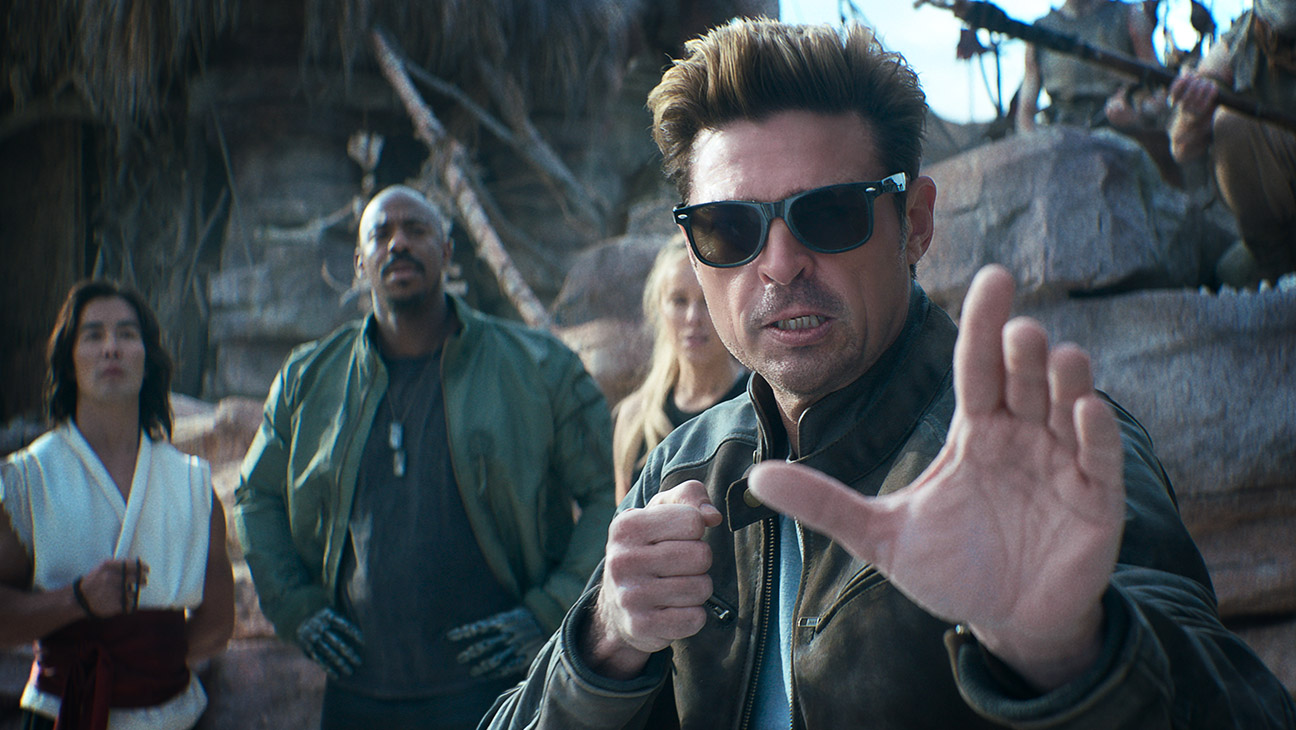 (L-R) Ludi Lin as Liu Kang, Mehcad Brooks as Jackson ‘Jax’ Briggs, Jessica McNamee as Sonya Blade, and Karl Urban as Johnny Cage in New Line Cinema’s Mortal Kombat II