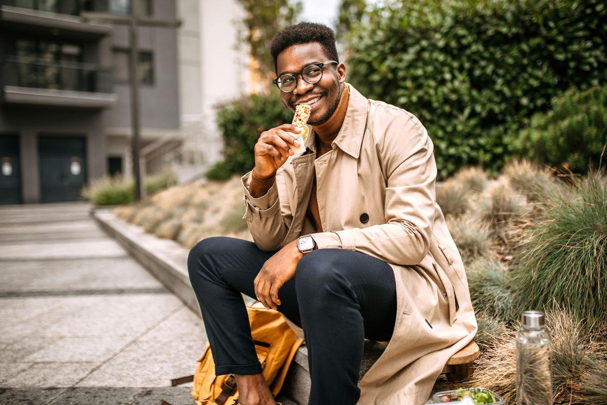 Person eating a protein bar