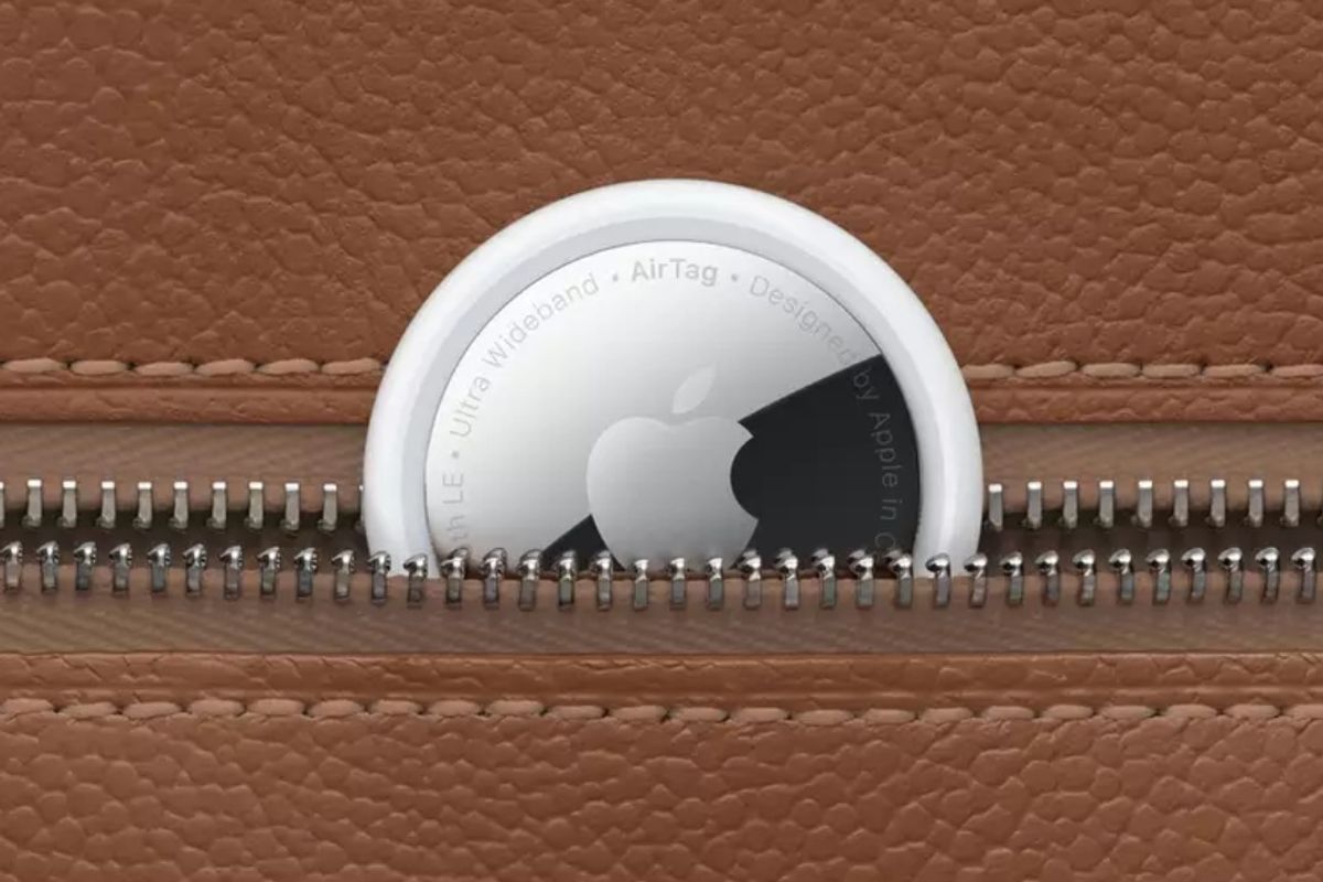 Apple AirTag tucked into a brown purse or wallet