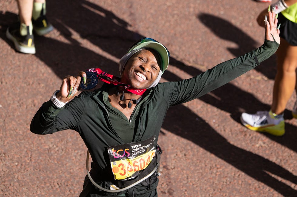 cynthia erivo smiling with her 2022 london marathon medal