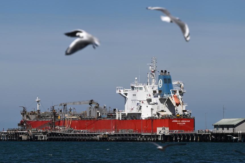 A fuel tanker docked at a port