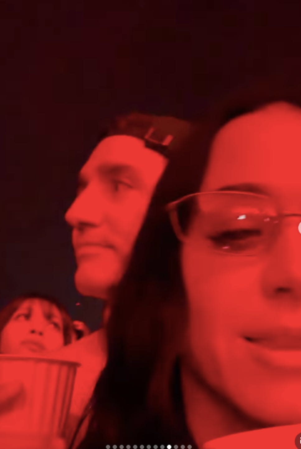 A group of people in a dimly lit environment.