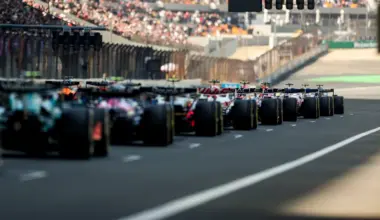 SUZUKA, JAPAN - MARCH 29: Fernando Alonso of Spain and Aston Martin F1 Team talks on the grid