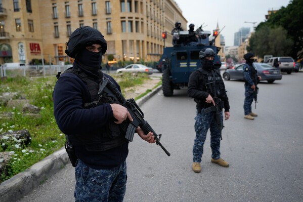 Special forces police officers deployed amid tensions between people displaced by Israeli strikes and local residents in Beirut neighborhoods, Lebanon, Wednesday, April 1, 2026. (AP Photo/Hussein Malla)