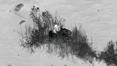 Cyclist airlifted from Australia's Snowy River after becoming stranded in rising waters - video