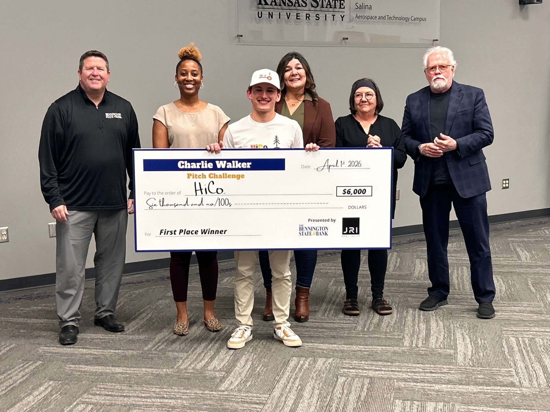 Liam Deniau-Young of HiCo. proudly holding up $6,000 check for winning 1st place in the 2026 Charlie Walker Pitch Challenge at the KSU Salina campus - Photo, Salina Community Economic Development Organization
