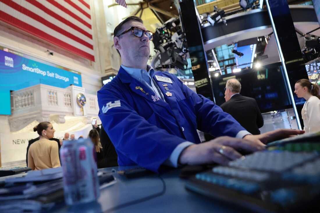 Traders work on the floor of the New York Stock Exchange during morning trading on April 02, 2026 in New York City.