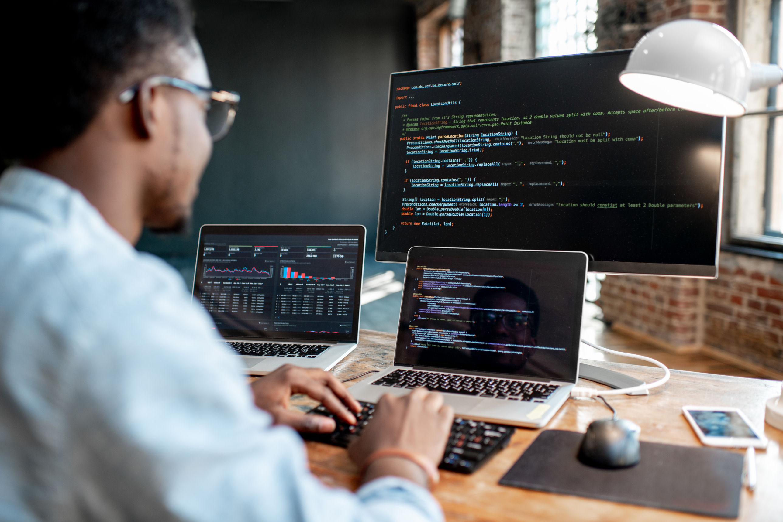 A computer programmer is writing code.