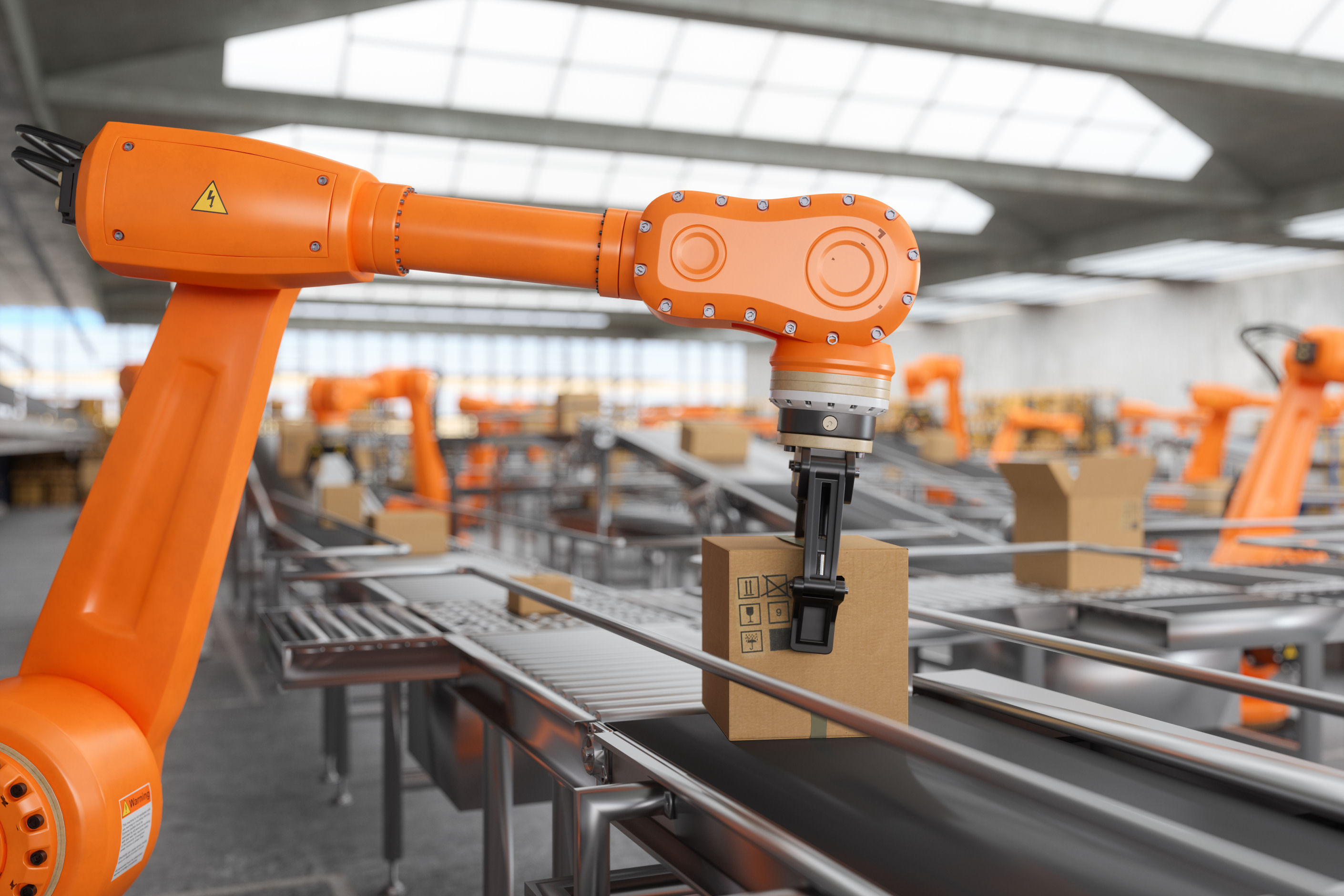 A robotic arm is placing a package on a conveyer belt.