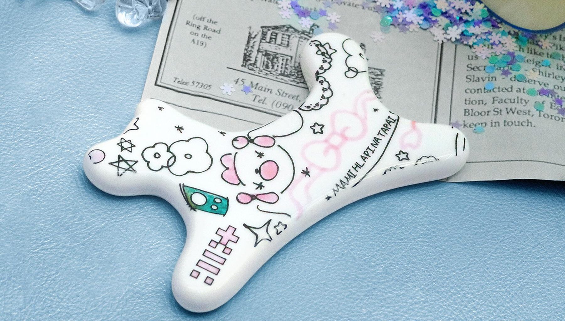 ILLIT’s upcoming EP “MAMIHLAPINATAPAI” (Gua Sha Ceramic Objet version) / Courtesy of Belift Lab