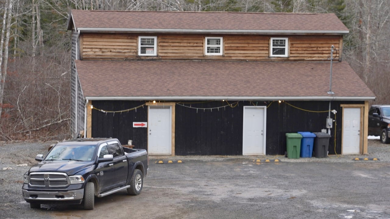 A house with a pickup truck parked near it