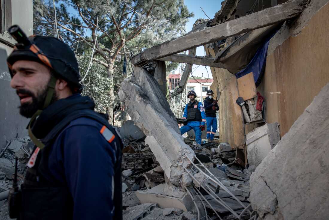 Paramedics from the Nabatieh Medics search a building for survivors minutes after an Israeli airstrike on April 13 in Nabatieh, Lebanon. Continued Israeli bombardment of Nabatieh has turned the city into a ghost town, most of the cities residents have left, for medical teams working in the city comes at huge risk. In recent weeks ambulances, rescue crews and paramedics across Lebanon have come under repeated Israeli attacks. On March 25 two members of the Nabatieh Medics, Joud Mohammed Suleiman (16) and Ali Jaber (22) were killed in a targeted Israeli drone strike, despite wearing their medical uniforms and being clearly marked as paramedics. Further strikes on medical workers in villages across Lebanon has pushed the death toll of first responders to over fifty since the start of the war in early March. (Photo by Chris McGrath/Getty Images)